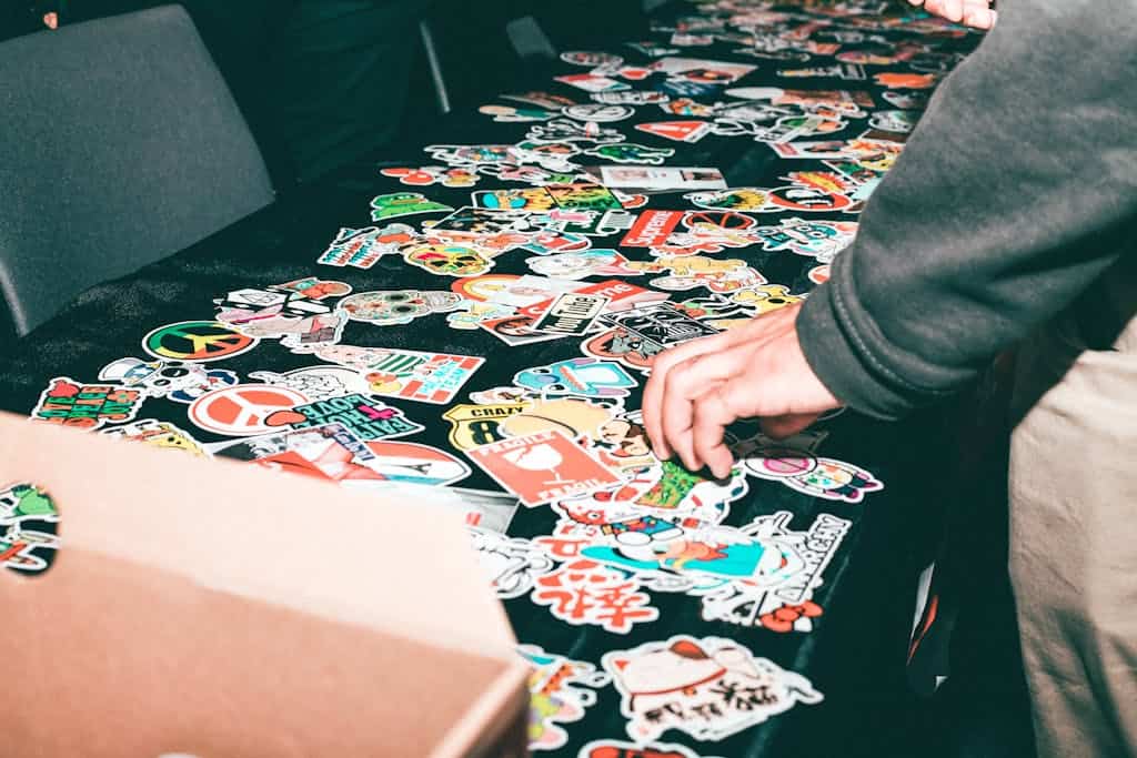 Vibrant assortment of stickers displayed on a table indoors.