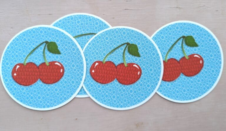 printed cherry stickers, blue circles, bright red cherries
