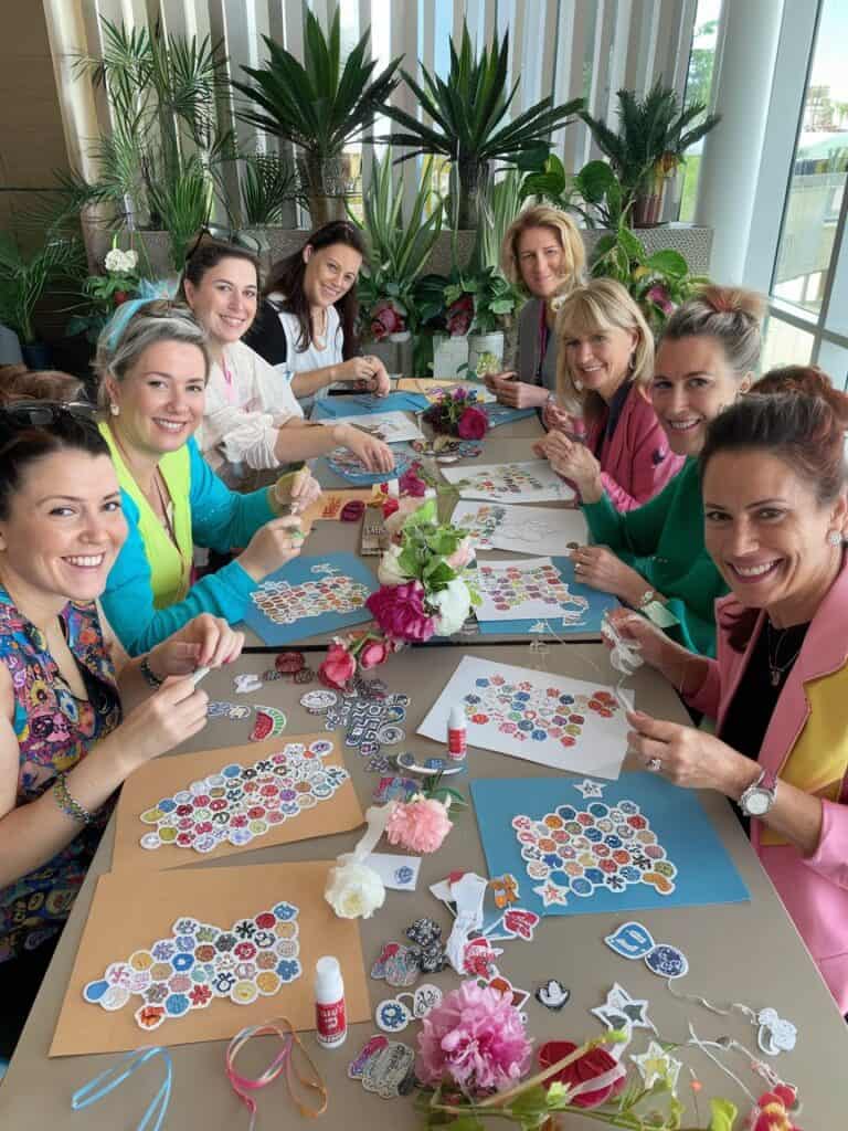 a group of women creating easy craft projects with stickers