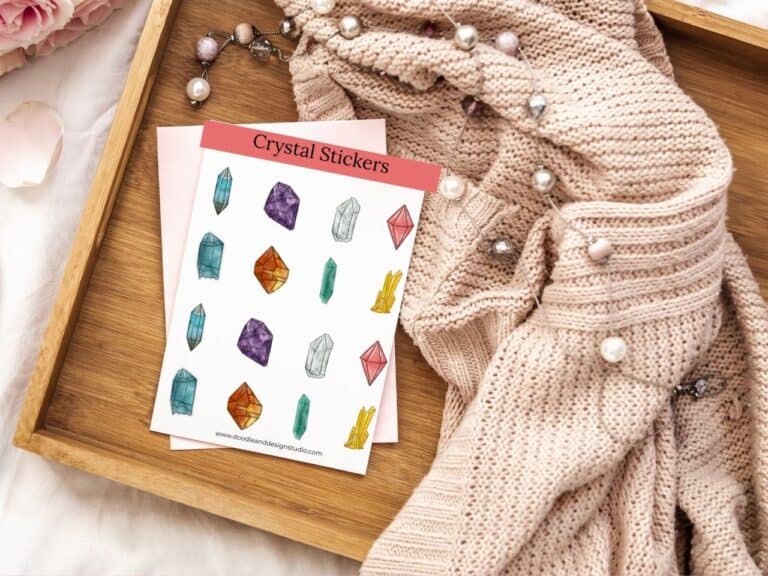 printable stickers crystal sticker set on wooden tray with a soft beige sweater in background