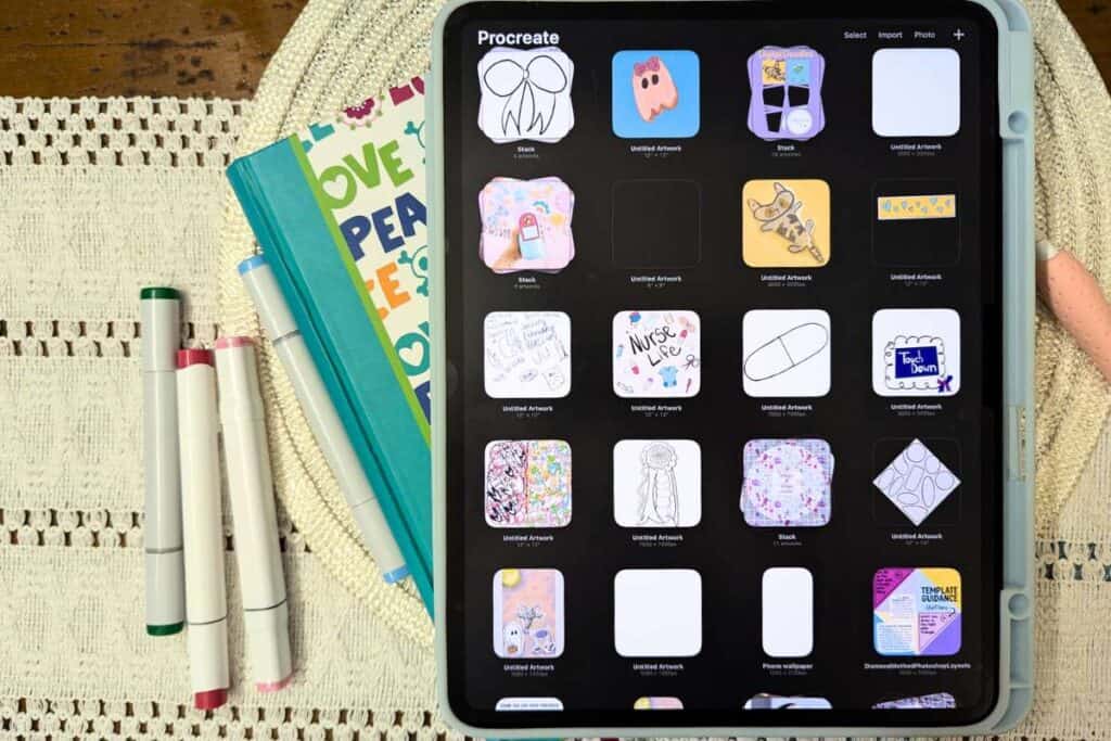 flay lay of procreate open on ipad with markers and notebook in background what is digital art