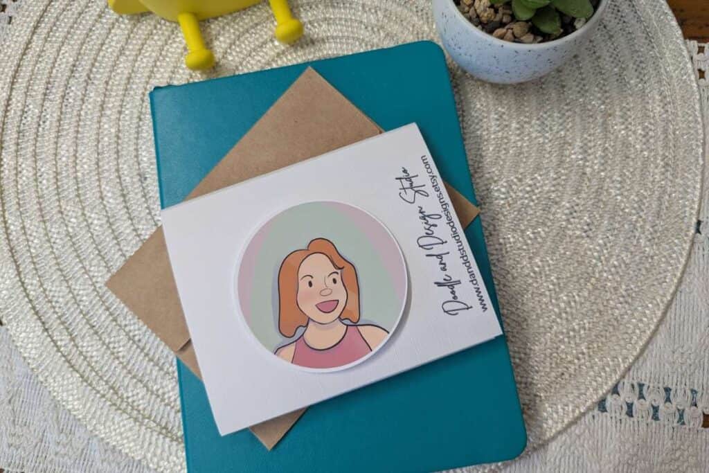 sticker mock up on top of greeting card laying on teal notebook what is digital art and how to sell it