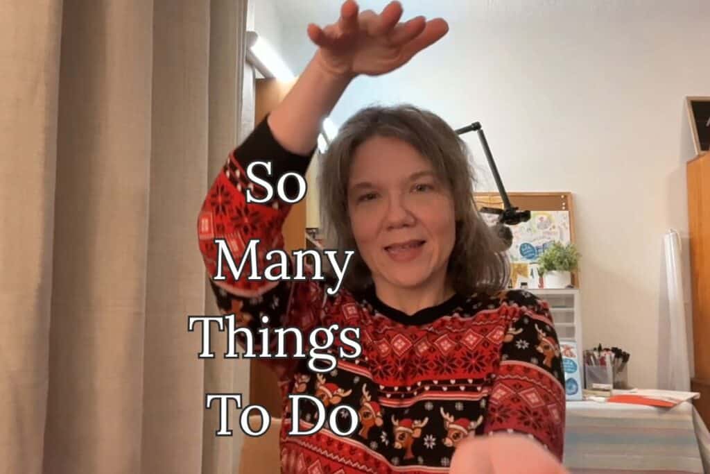 A woman in a festive sweater raises one hand above her head, expressing overwhelm; the phrase “So Many Things To Do” is written beside her on the curtain.