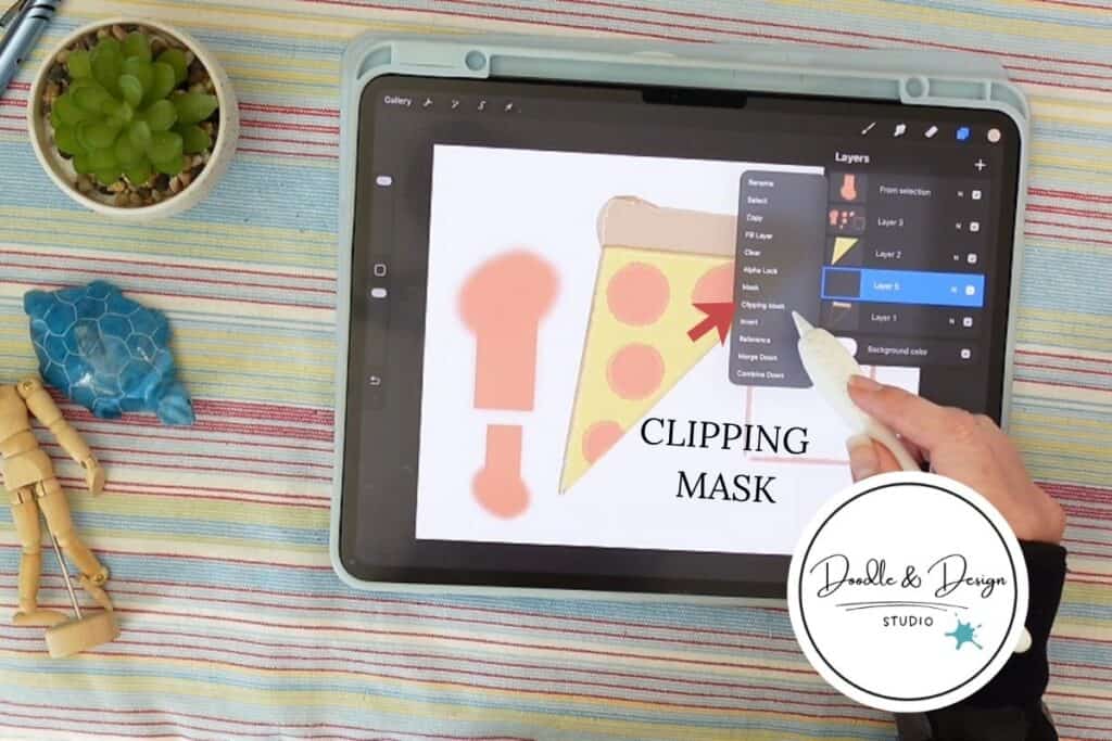 ipad on striped surface showing a slice of pizza clipping mask is being applied